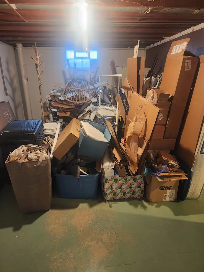 Roll-off dumpster container at job site for 2 Yard Dumpster Rental in West Bend